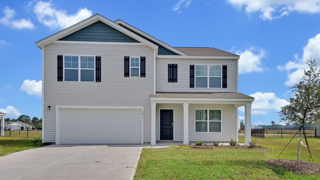 Front exterior of a home in the Patriot Pointe at Towne Pointe community, located in Jacksonville, NC (Image 6). Front exterior of a home in the Patriot Pointe at Towne Pointe community, located in Jacksonville, NC (Image 6).