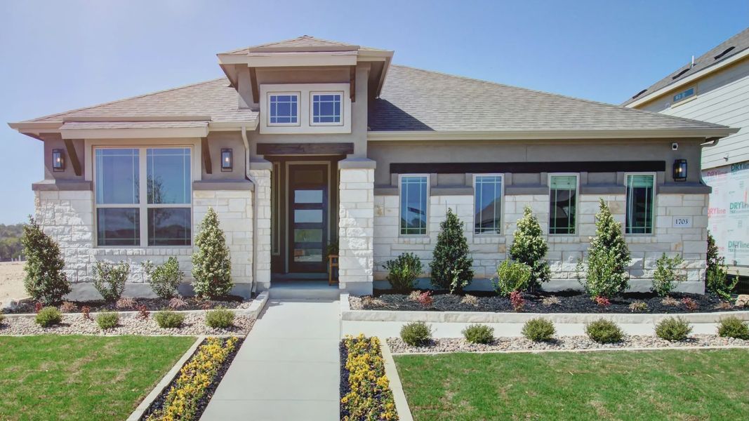 Elegant stone facade, expansive windows, and pristine landscaping define this luxurious Meyer Ranch home. Elegant stone facade, expansive windows, and pristine landscaping define this luxurious Meyer Ranch home.