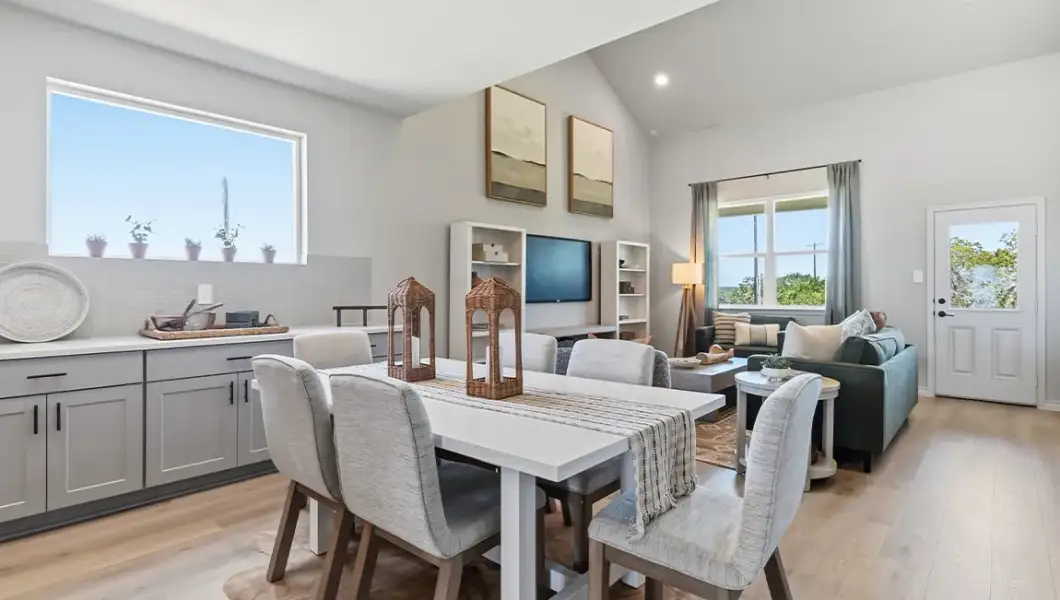 Furnished interior in a model home at The Woodlands at Medina Hills in Mico (Image 14).