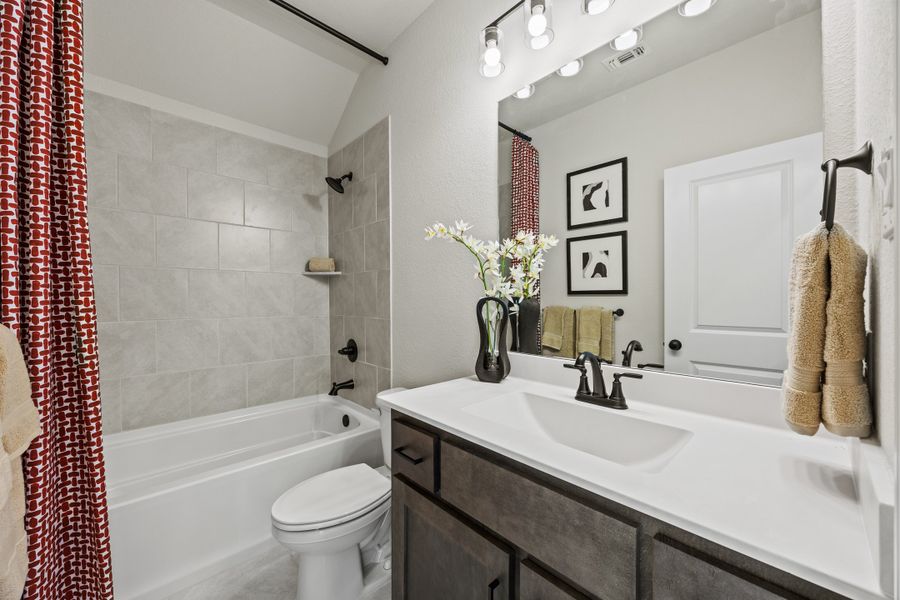 Furnished interior in a model home at El Dorado in Granbury (Image 25).