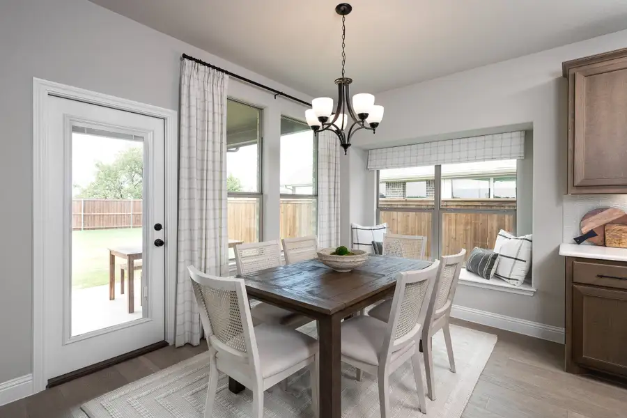 Furnished interior in a model home at Silo Mills - Signature Series in Joshua (Image 13).