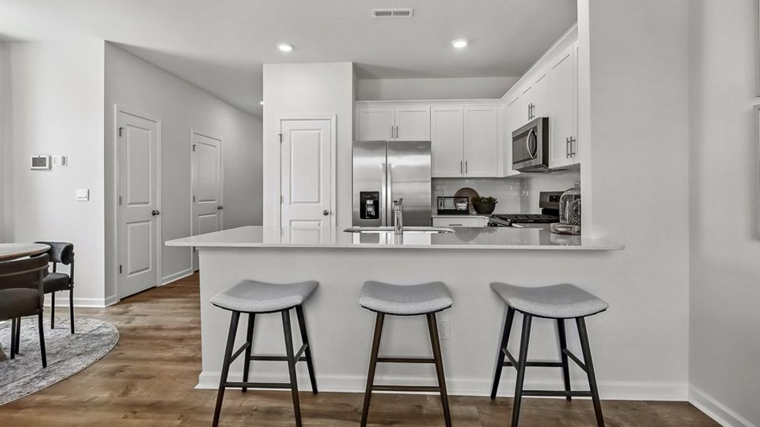 Furnished interior in a model home at The Townes at Prestleigh in Wake Forest (Image 17).
