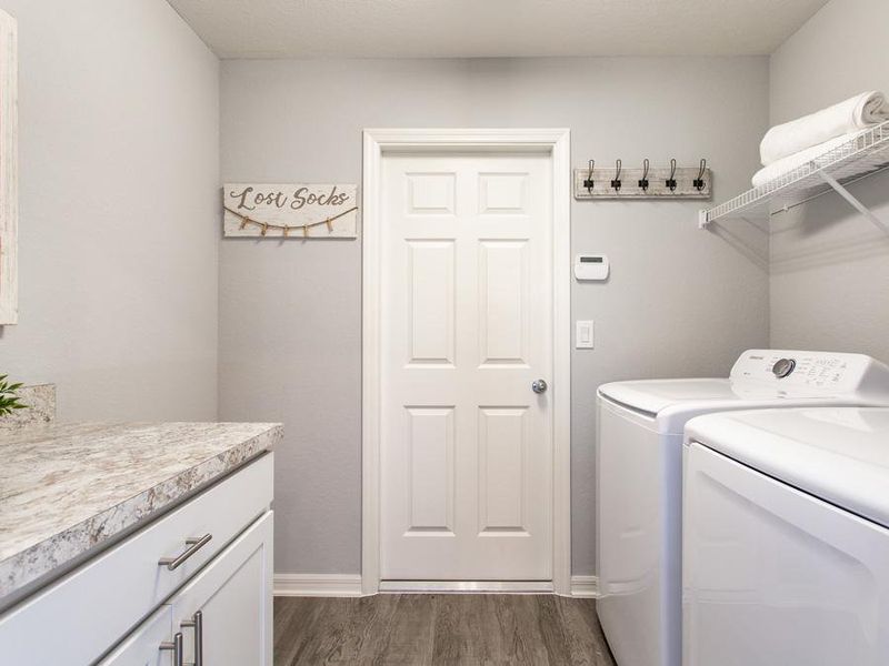 A convenient drop zone at the garage entry helps keep clutter off your kitchen counters - Serendipity model home in Winter Haven