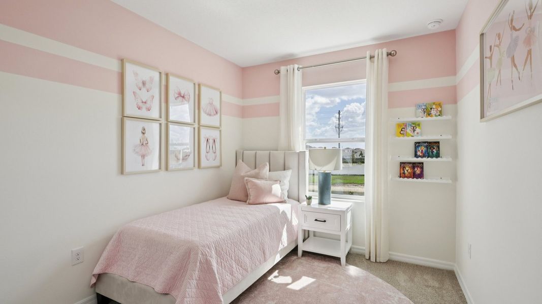 Furnished interior in a model home at Towns at Woodsdale in Wesley Chapel (Image 19).