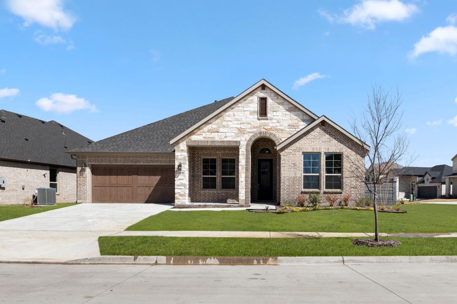 Front exterior of a home in the Union Park 60s community, located in Little Elm, TX (Image 15).