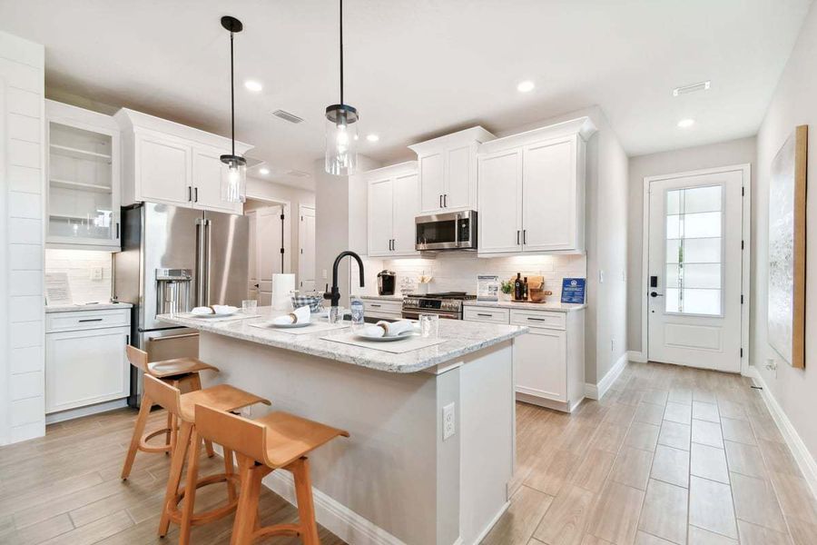 Furnished interior in a model home at Fairway Pointe - 55+ Villa Community in Sun City Center (Image 5).