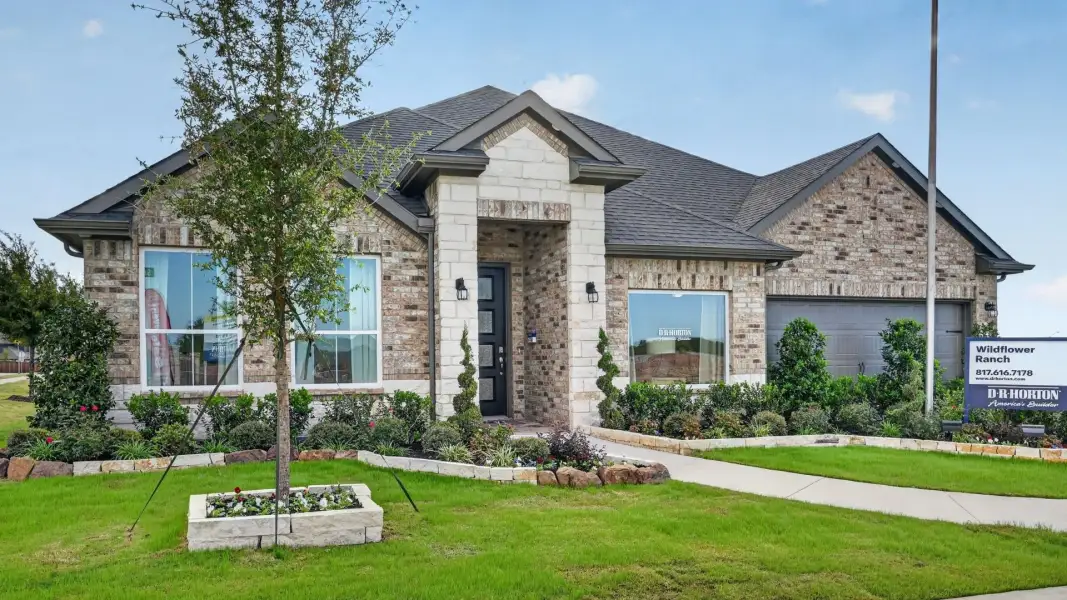 Front exterior of a home in the Wildflower Ranch community, located in Justin, TX (Image 6).