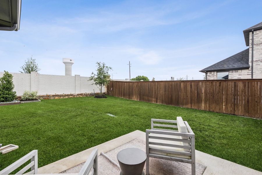 REPRESENTATIVE PHOTO – Patio in a Lakehaven Oak model home in Farmersville TX by Trophy Signature Homes