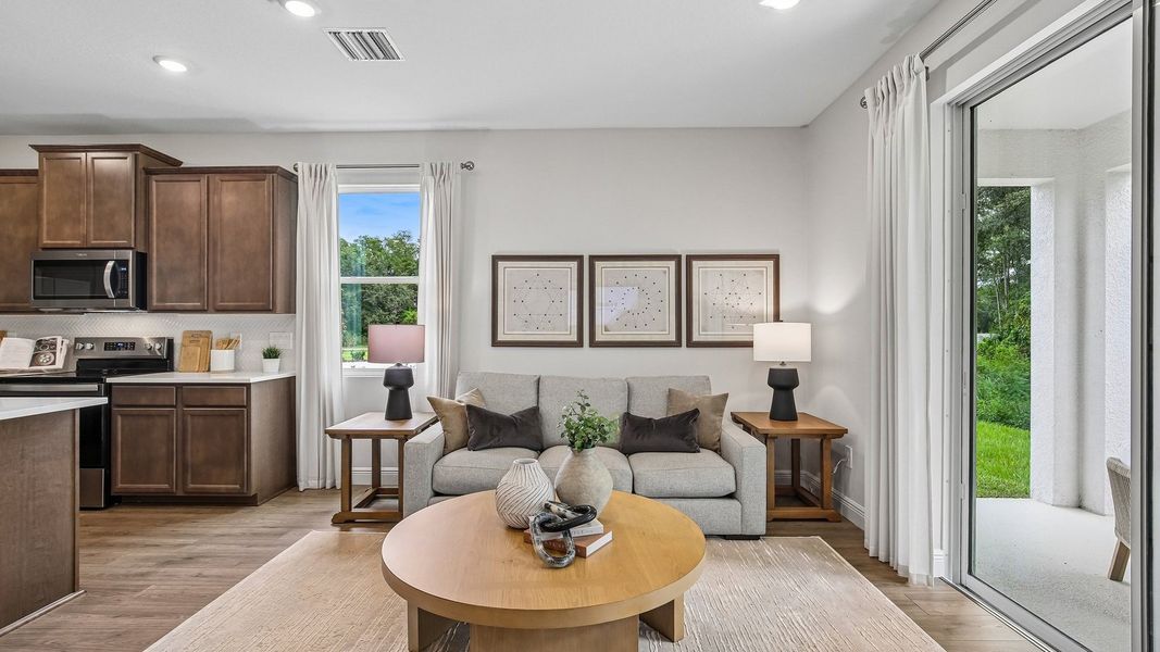 Furnished interior in a model home at Sanctuary at Citrus Park Townhomes in Tampa (Image 10).