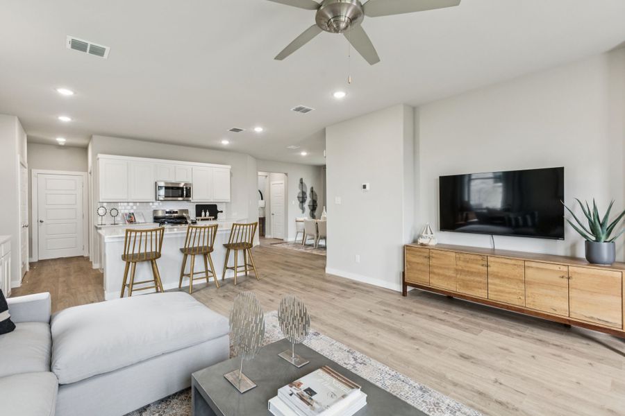 REPRESENTATIVE PHOTO – Living Room in a Lakehaven Oak model home in Farmersville TX by Trophy Signature Homes