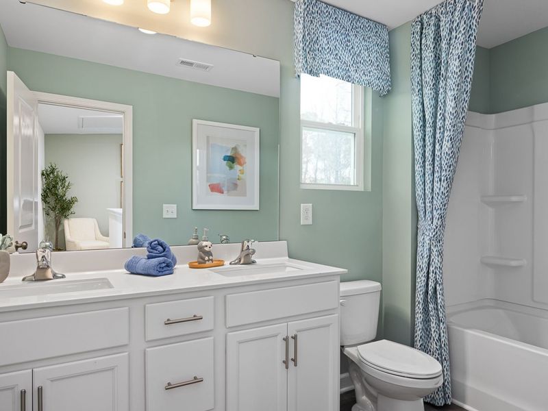 Furnished interior in a model home at Gregory Village Townhomes in Lillington (Image 14).