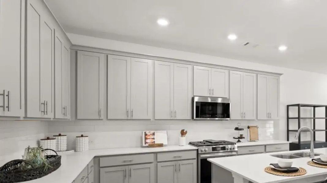 Furnished interior in a model home at Forrest Crossing: Forrest Crossing Single Family in Woodstock (Image 7).