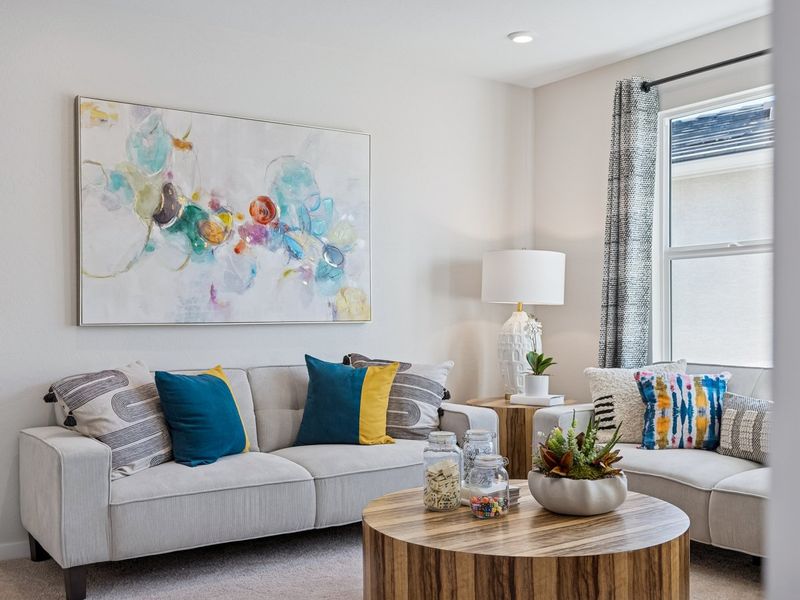 A living room with a couch and a coffee table.