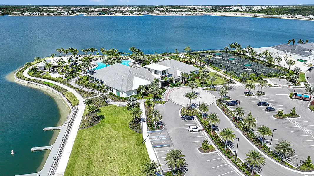 Aerial view of the Esplanade Lake Club community in Fort Myers, FL, showing layout and nearby surroundings (Image 1). Aerial view of the Esplanade Lake Club community in Fort Myers, FL, showing layout and nearby surroundings (Image 1).