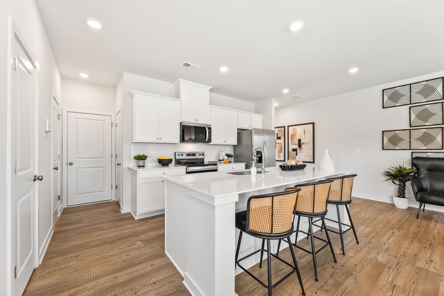 A kitchen with white cabinets. A kitchen with white cabinets.