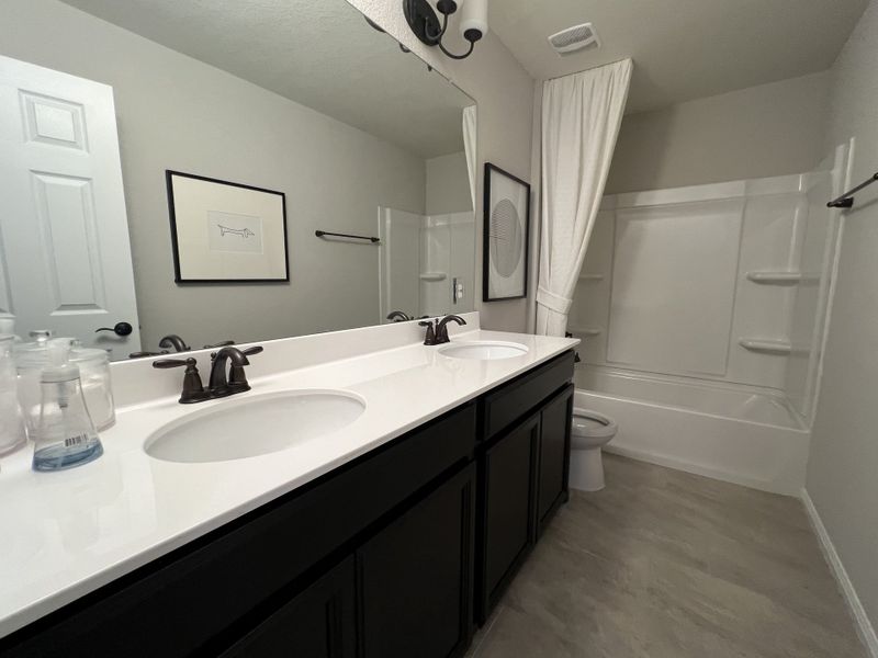 Furnished interior in a model home at Summerlyn in Leander (Image 21).