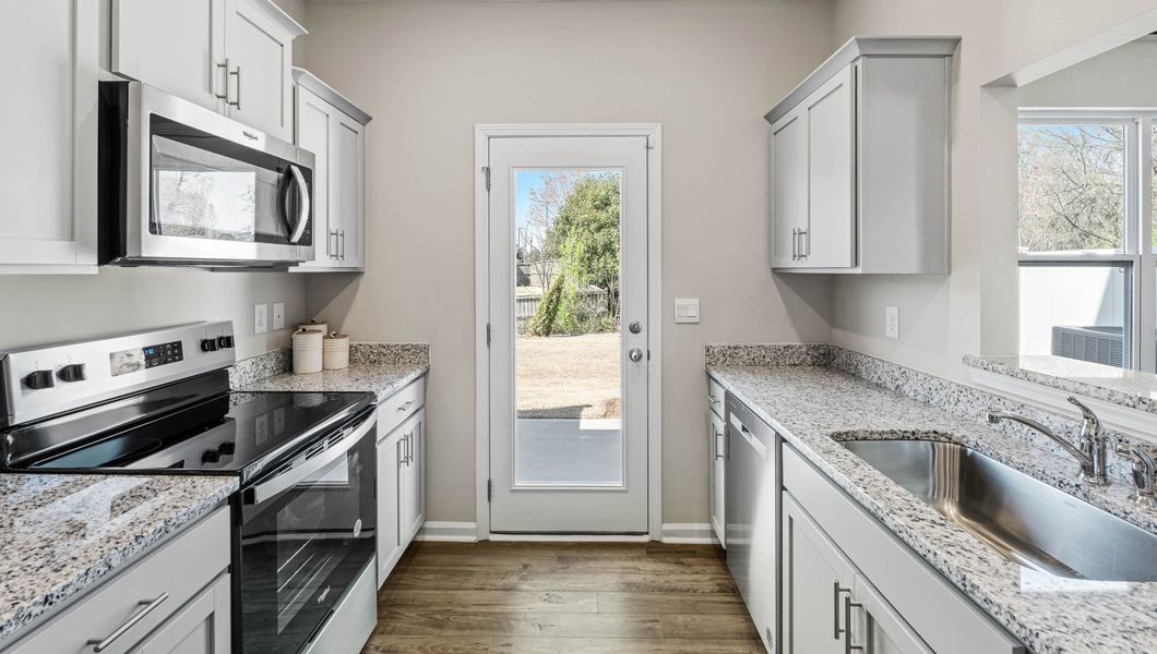 Furnished interior in a model home at Covington Village in Greer (Image 12).