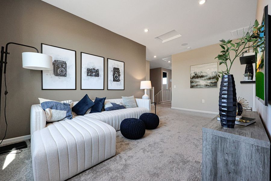 A living room with a couch and a coffee table. A living room with a couch and a coffee table.