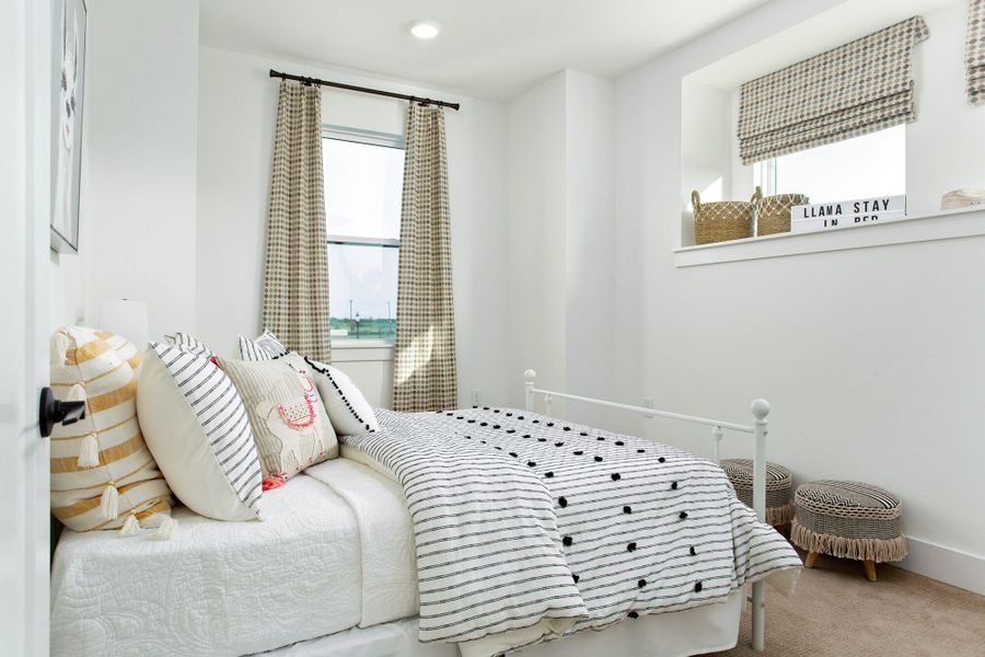 Furnished interior in a model home at Windsong Ranch Townhomes in Prosper (Image 14).