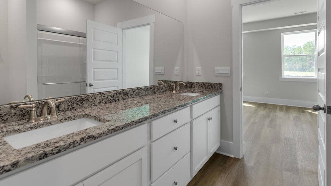 Furnished interior in a model home at Indigo Preserve Townhomes in Leland (Image 11).