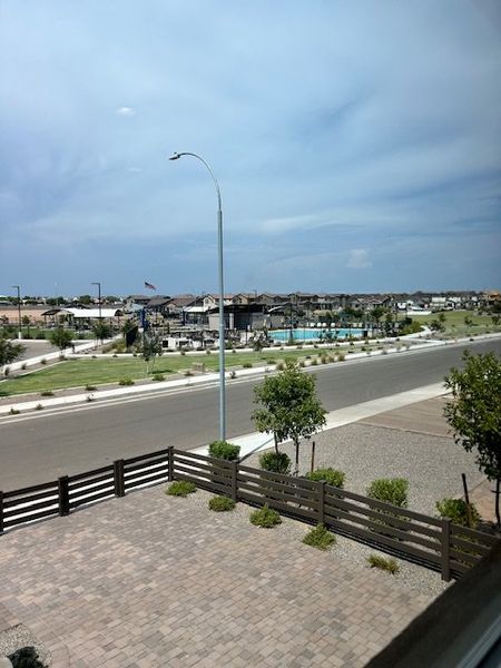 A scenic view of a landscaped community road in Parkside Almeria Collection by Taylor Morrison (Avondale, AZ).