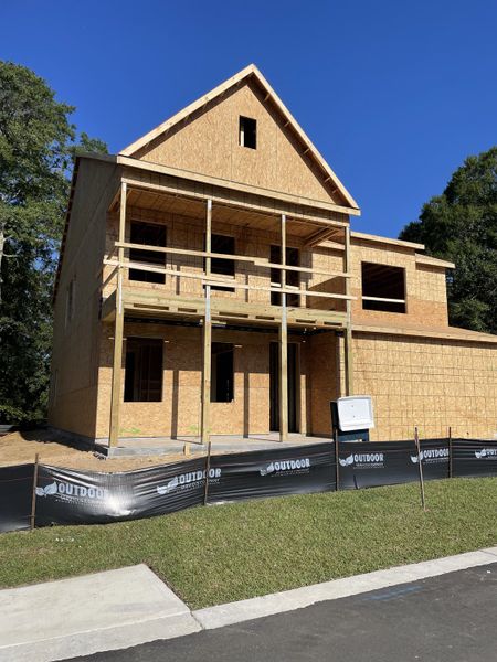A future home taking shape in Founders Corner by D.R. Horton, Lincolnville, SC, with a newly framed structure and spacious porch.