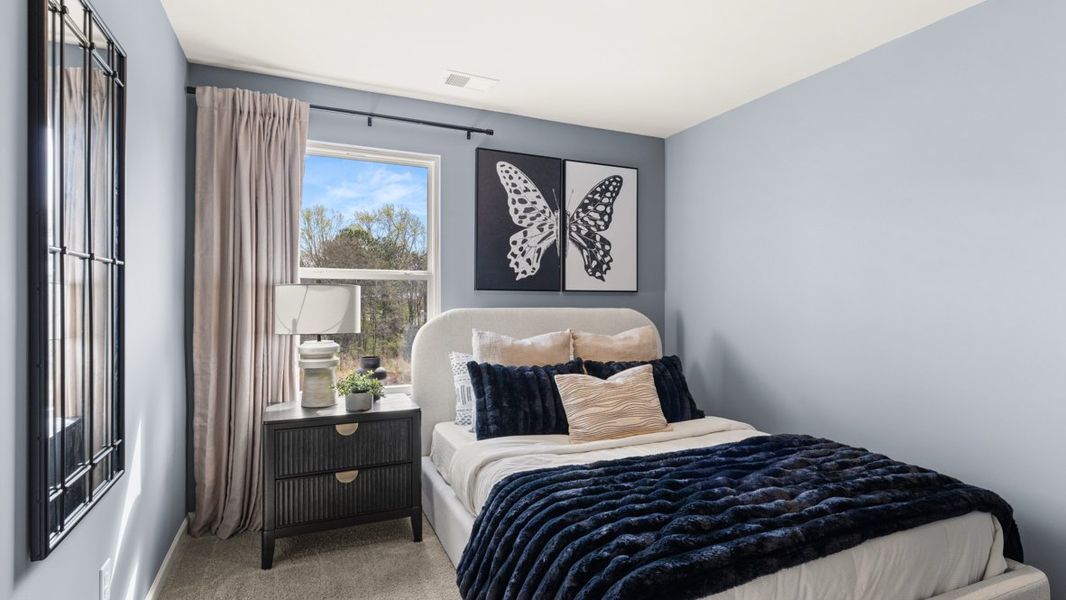 Furnished interior in a model home at Carlton in Douglasville (Image 14).