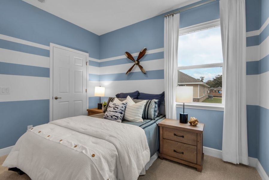 Furnished interior in a model home at Southern Palms in Pace (Image 11).