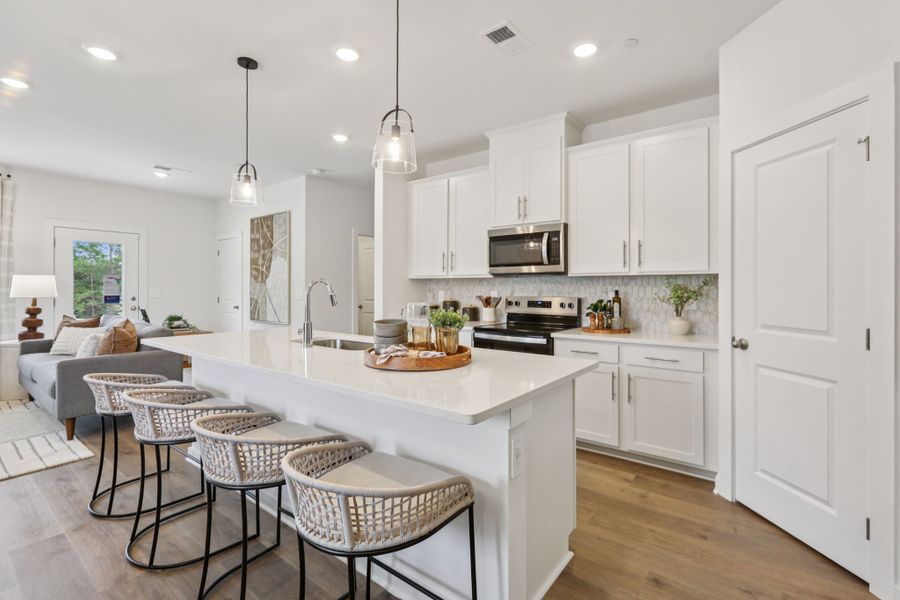 Furnished interior in a model home at Cedarcrest Townhomes in Fairview (Image 6).