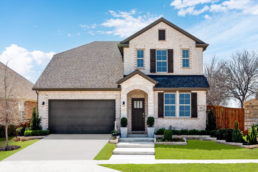 Front exterior of a home in the Lake Pointe community, located in Little Elm, TX (Image 2).