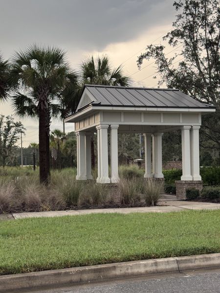 An elegant open pavilion amidst lush landscaping at TrailMark by Dream Finders Homes in St. Augustine, FL.