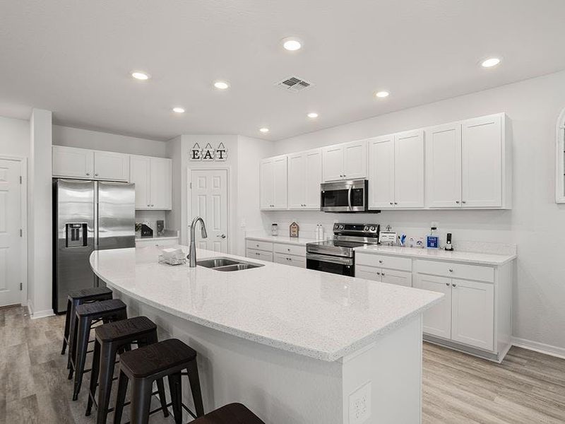 Enjoy a bright, open kitchen - Wesley II model home in Winter Haven, FL