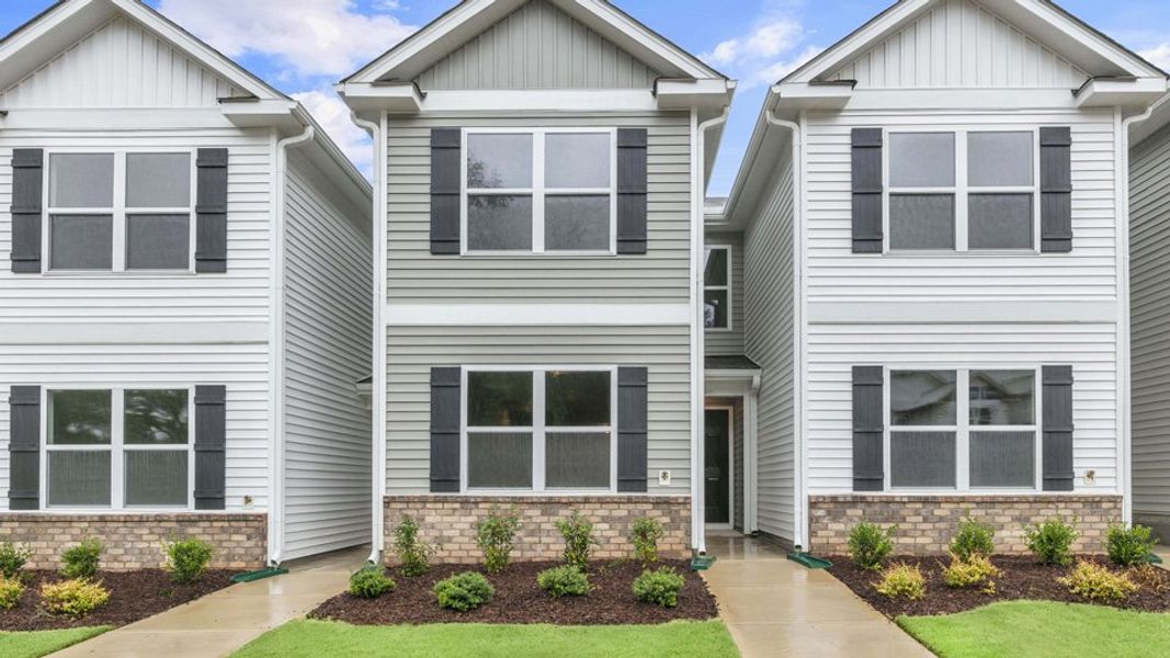 Front exterior of a home in the The Townes at Wilson's Ridge community, located in Wilson's Mills, NC (Image 4).