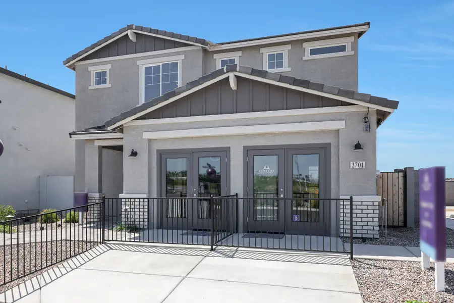 A house with a black fence. A house with a black fence.