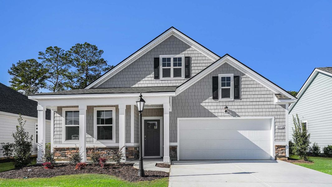 Front exterior of a home in the Brunswick Plantation community, located in Ash, NC (Image 4). Front exterior of a home in the Brunswick Plantation community, located in Ash, NC (Image 4).