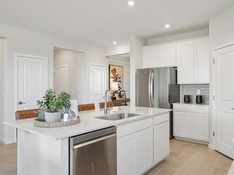 A kitchen with white cabinets. A kitchen with white cabinets.