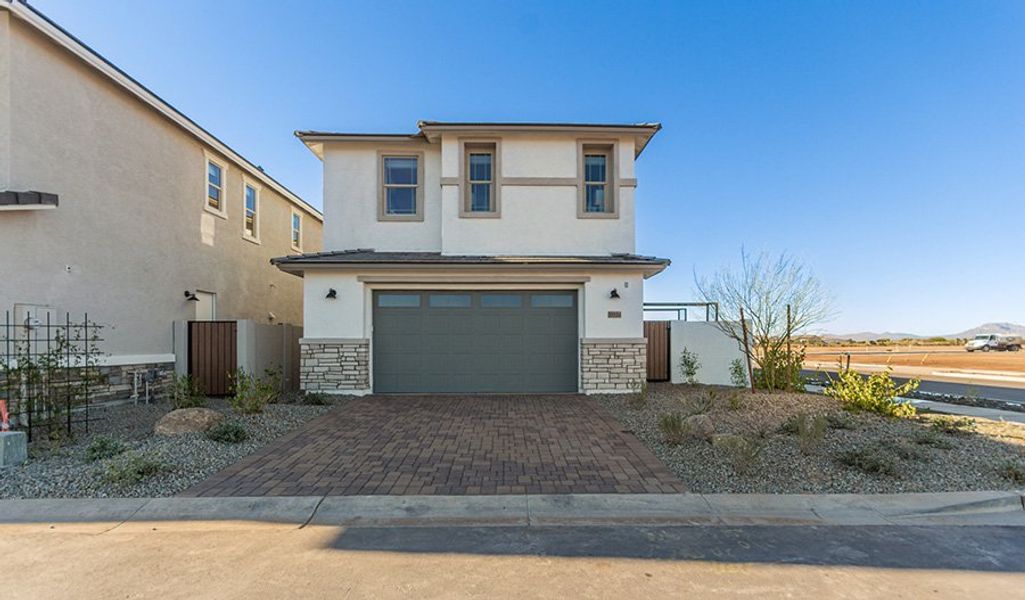 Front exterior of a home in the Fusion at Blossom Rock community, located in Apache Junction, AZ (Image 25).