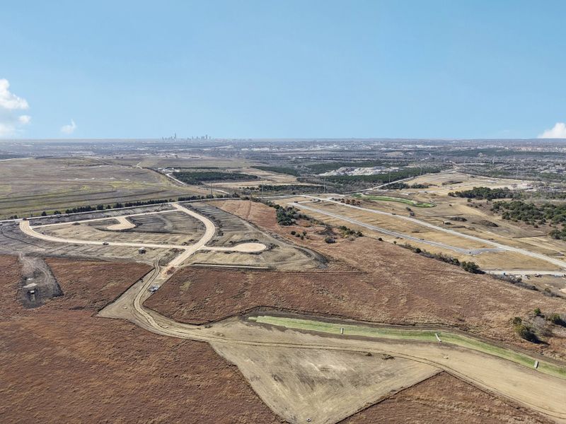 A landscape with a road and trees.