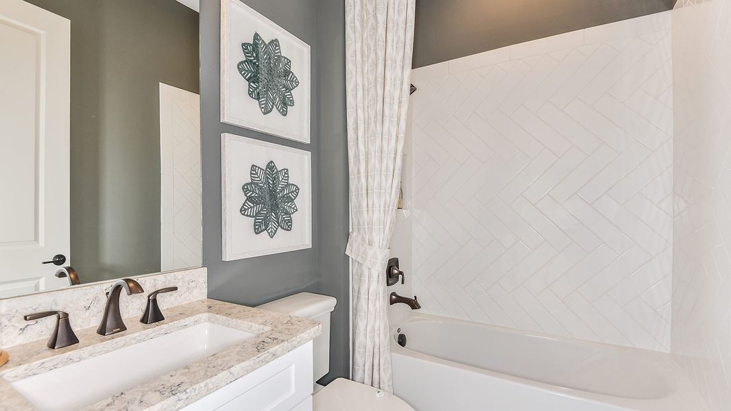 Furnished interior in a model home at Esplanade by the Islands in Naples (Image 40).