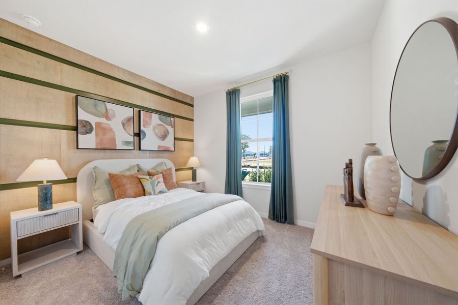 A bedroom with a large mirror. A bedroom with a large mirror.