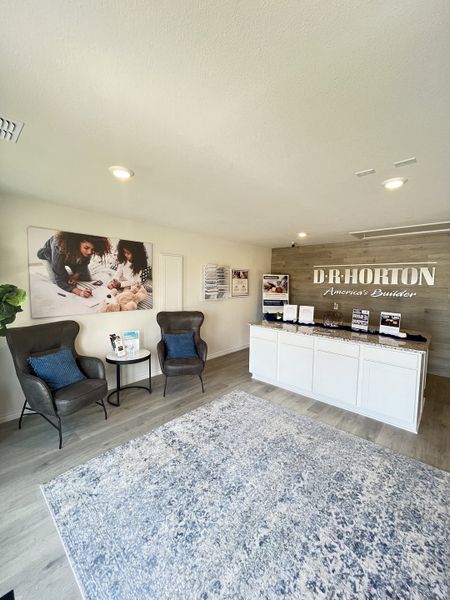 A welcoming lobby with plush seating, a stylish rug, and modern decor, creating a cozy atmosphere.