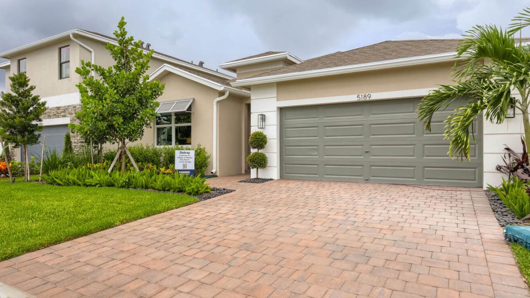 Front exterior of a home in the Blossom Trail community, located in Greenacres, FL (Image 2). Front exterior of a home in the Blossom Trail community, located in Greenacres, FL (Image 2).