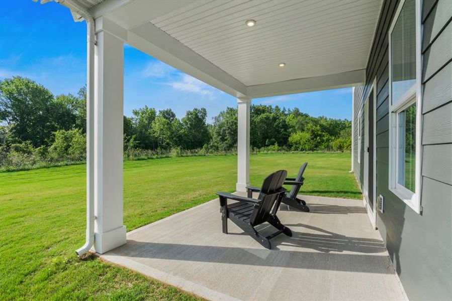 Enjoy the outdoors on your covered patio while the kids run around in the yard!