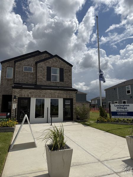 A modern brick home with elegant shutters and a manicured entrance in Lexington Village by D.R. Horton (Missouri City, TX). A modern brick home with elegant shutters and a manicured entrance in Lexington Village by D.R. Horton (Missouri City, TX).