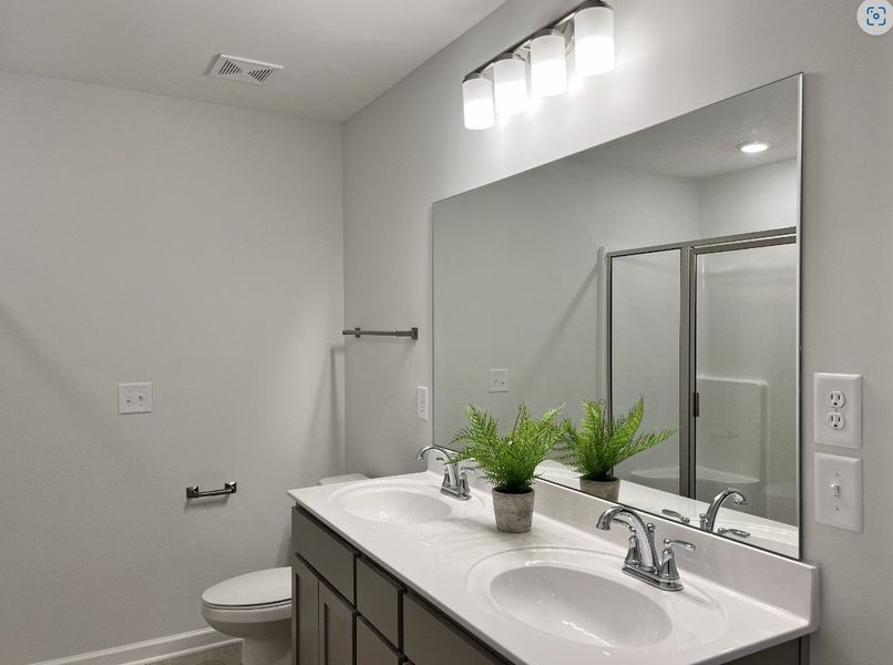 Unwind in this primary bathroom