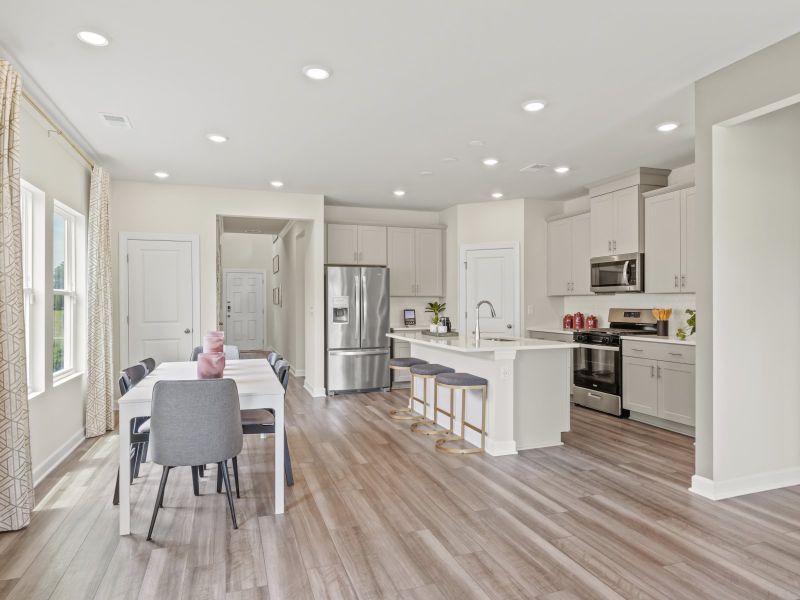 Sip your morning coffee at the kitchen island or host dinners in the open dining area.