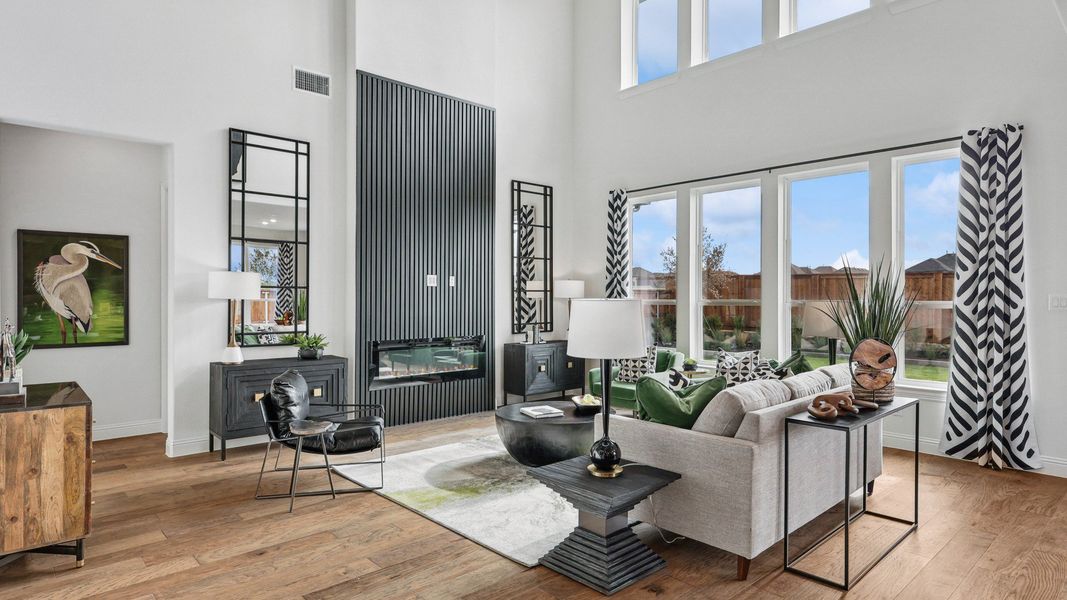 High ceilings and expansive windows enhance the refined living space in Green Meadows, exuding modern luxury.