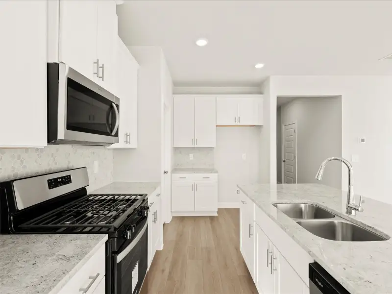 Furnished interior in a model home at Brayfield Manor - Signature Collection in Wellford (Image 2).