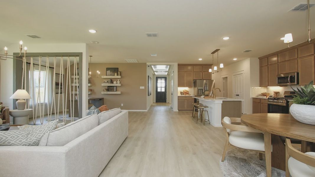 Discover elegant wood flooring and sophisticated light fixtures in Cielo's luxurious open-plan interior.