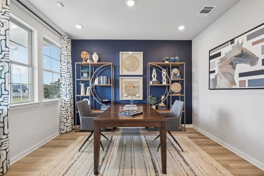 A room with a table and chairs.